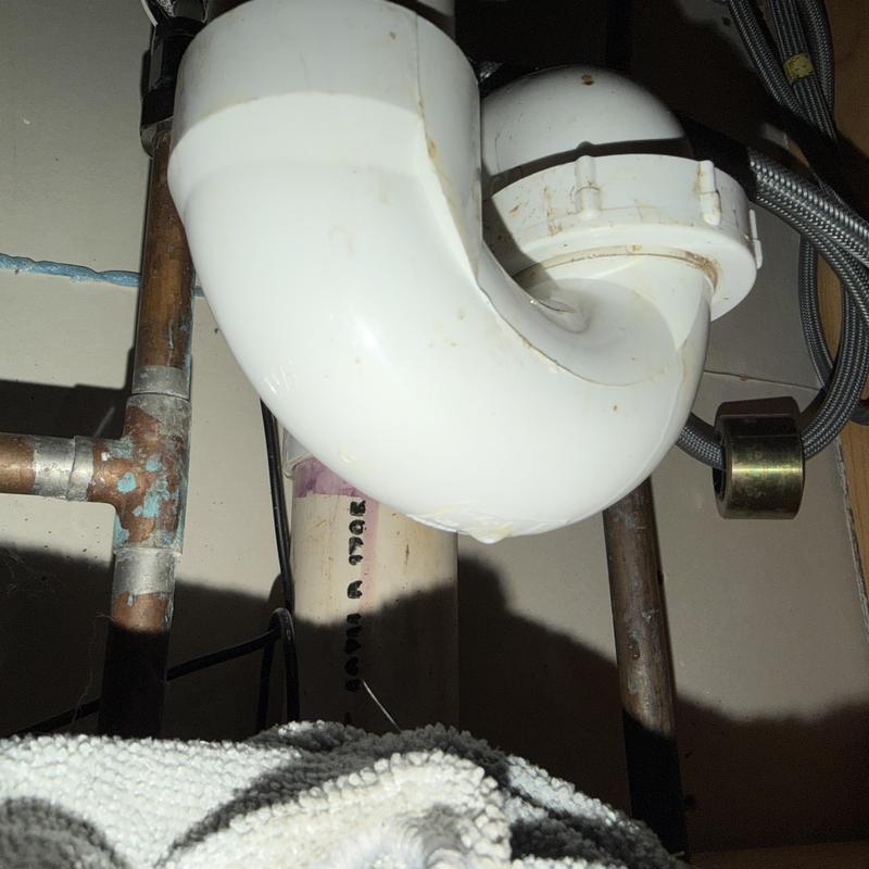 Kitchen sink PVC drain trap and copper supply pipes Kitchen sink PVC drain trap and copper supply pipes