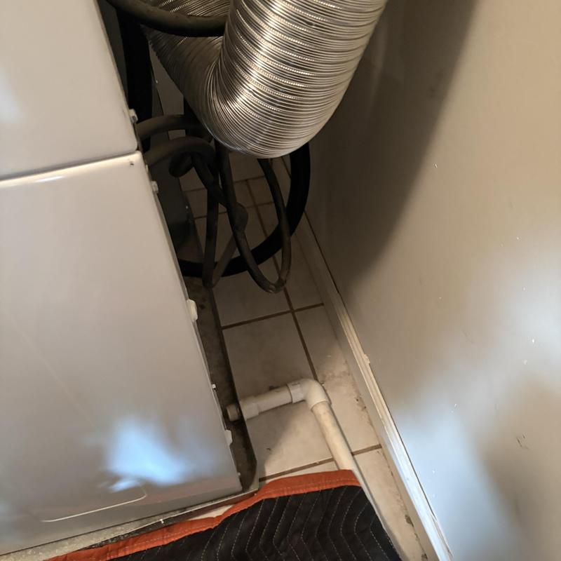 Laundry secondary drain line with vent pipe near dryer Laundry secondary drain line with vent pipe near dryer
