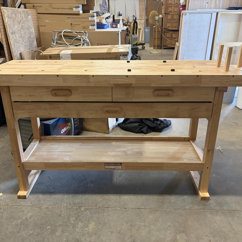 Wooden workbench with drawers in workshop Wooden workbench with drawers in workshop