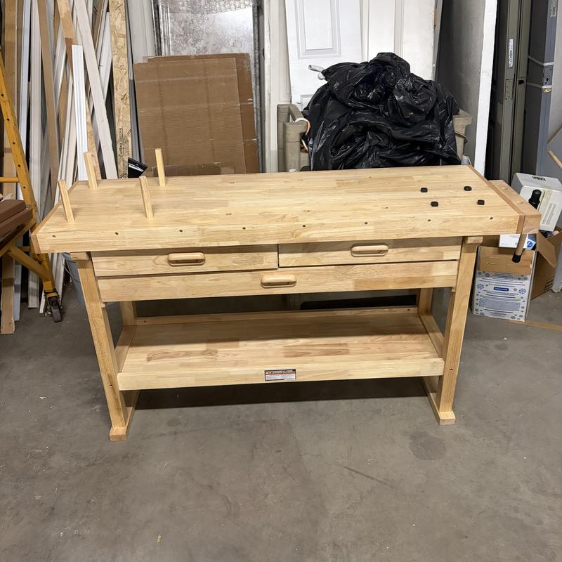 Wooden workshop workbench with drawers and vise Wooden workshop workbench with drawers and vise