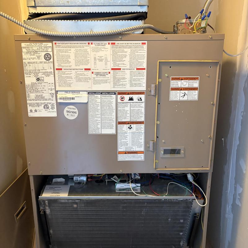 Commercial HVAC unit with open access panel and wiring Commercial HVAC unit with open access panel and wiring