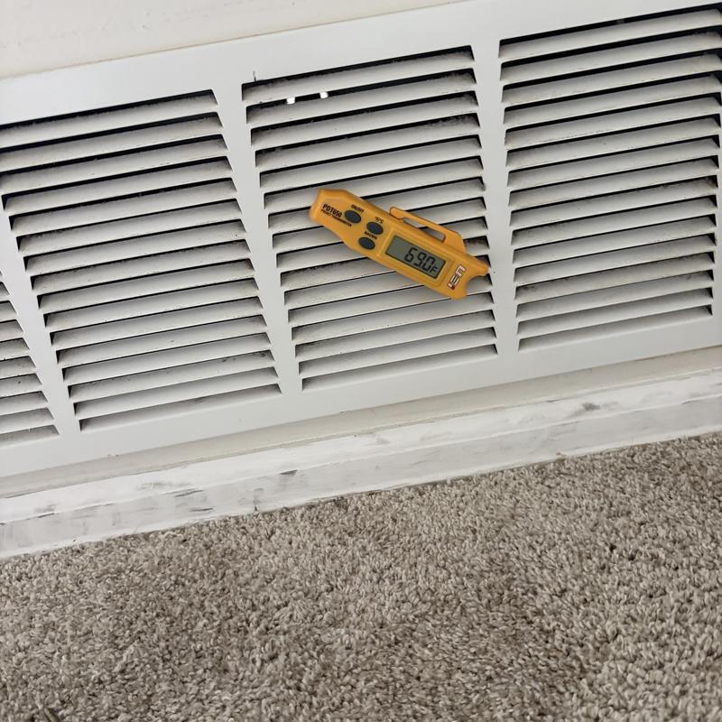 HVAC vent with temperature gauge reading 69°F HVAC vent with temperature gauge reading 69°F