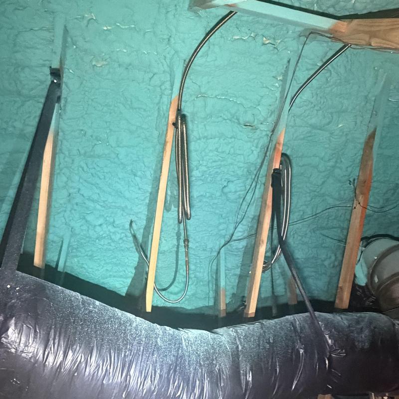 Spray foam insulation and flexible ductwork in attic space