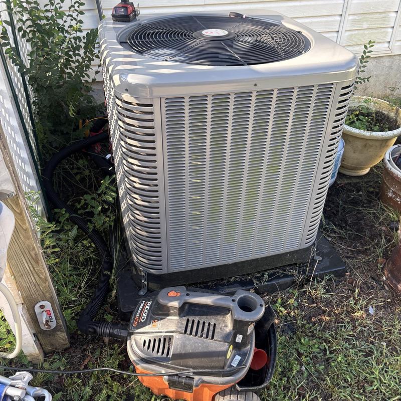 AC drain line vacuum cleaning with Ridgid tool outdoors AC drain line vacuum cleaning with Ridgid tool outdoors