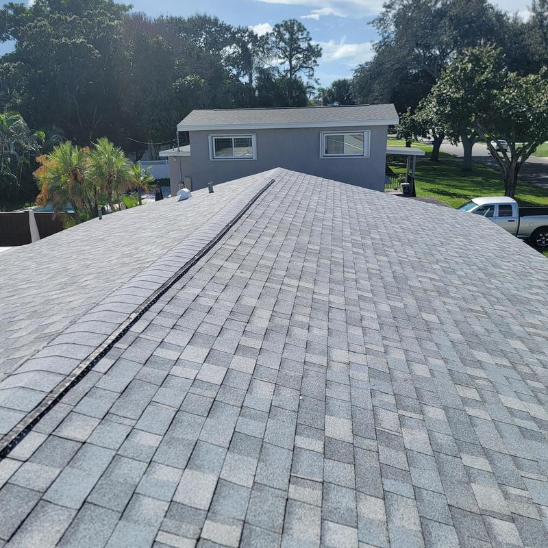 Shingle roof replacement with ridge vent installation