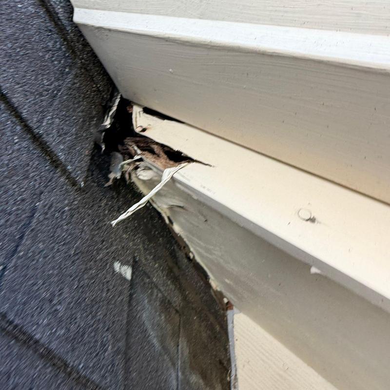 Roof flashing with water damage and rot decay
