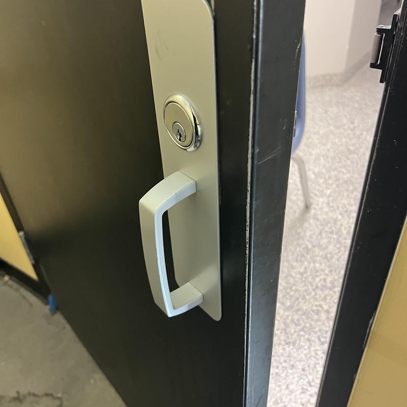 Exit device trim on commercial door lock Exit device trim on commercial door lock