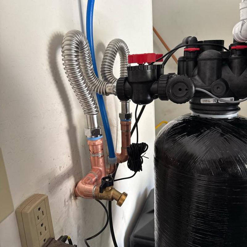 Water softener system with new pressure valve installed