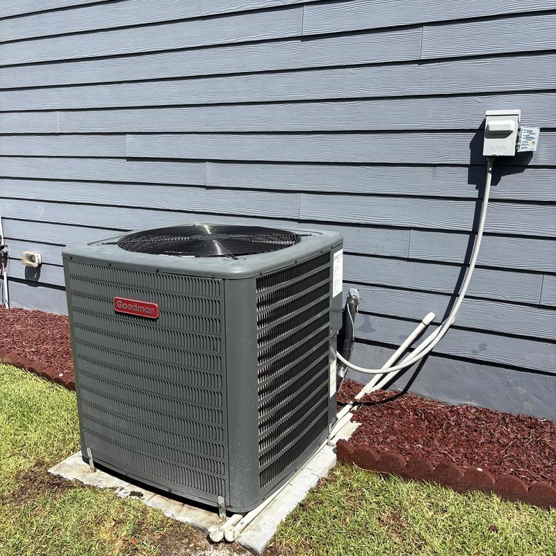 Goodman air conditioning unit outside a home Goodman air conditioning unit outside a home