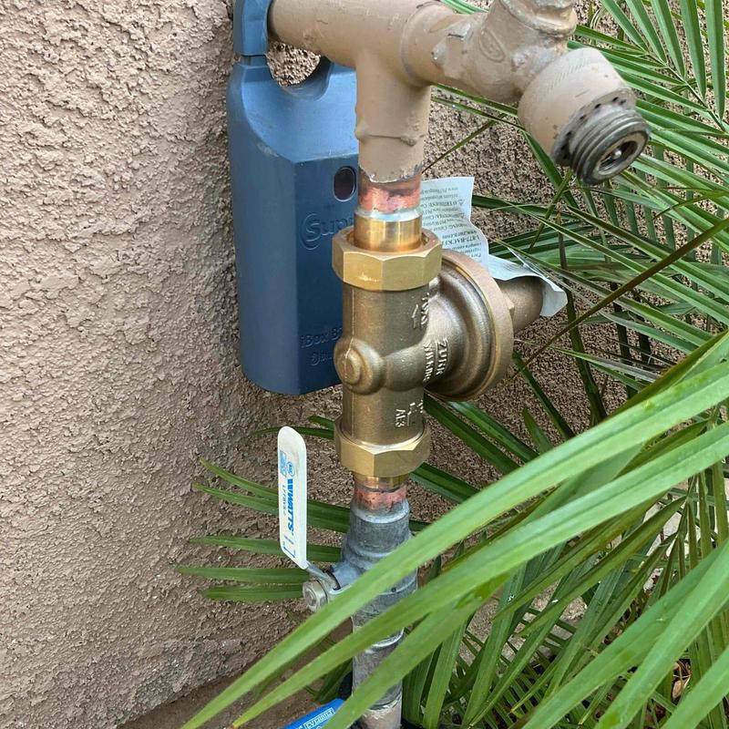 Brass water pressure regulator valve installed outdoors Brass water pressure regulator valve installed outdoors