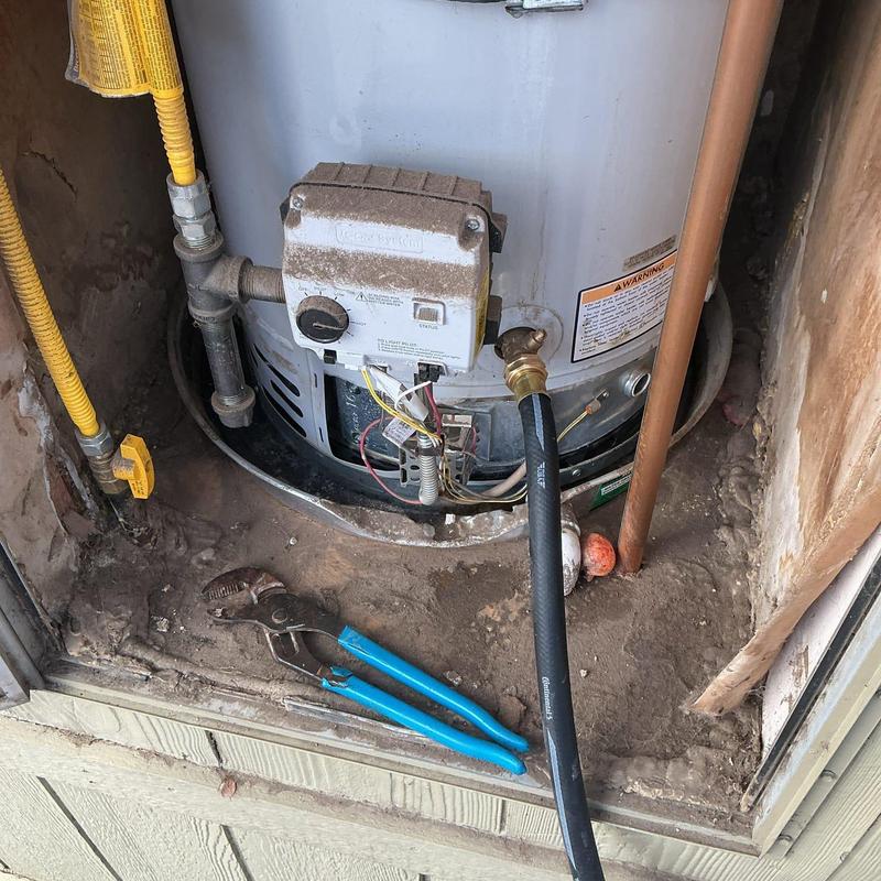 Water heater with hose and pliers in utility space Water heater with hose and pliers in utility space