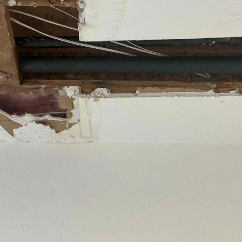 Copper hot water line in ceiling cavity with drywall removed Copper hot water line in ceiling cavity with drywall removed