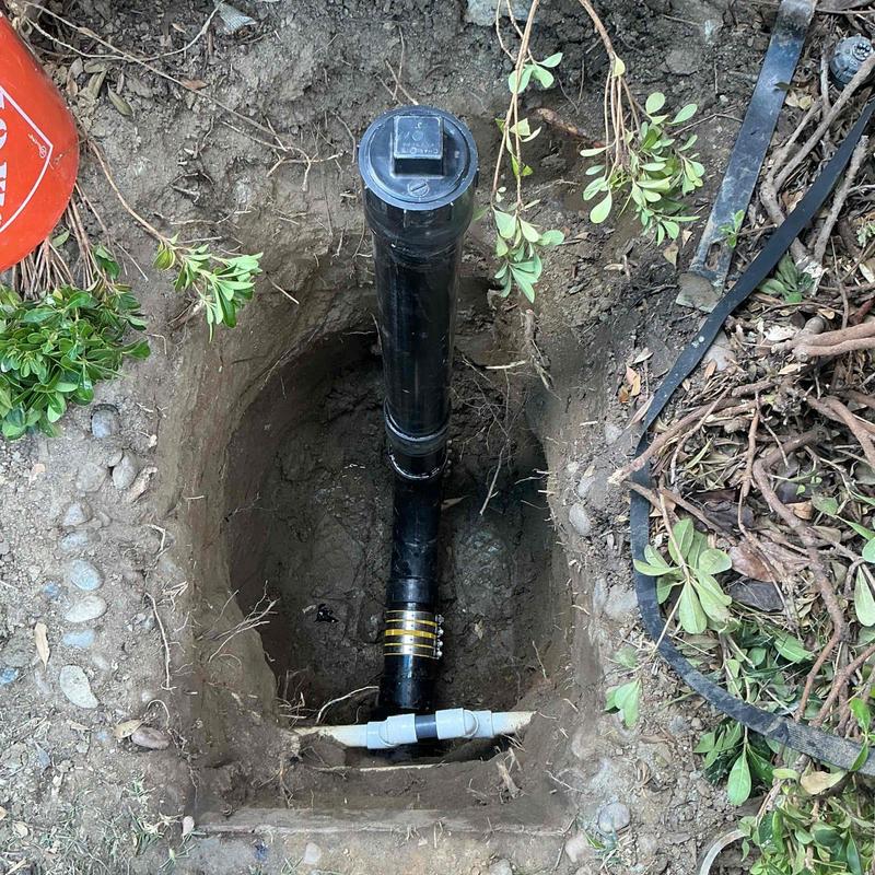 ABS sewer line with cleanout exposed in excavation ABS sewer line with cleanout exposed in excavation