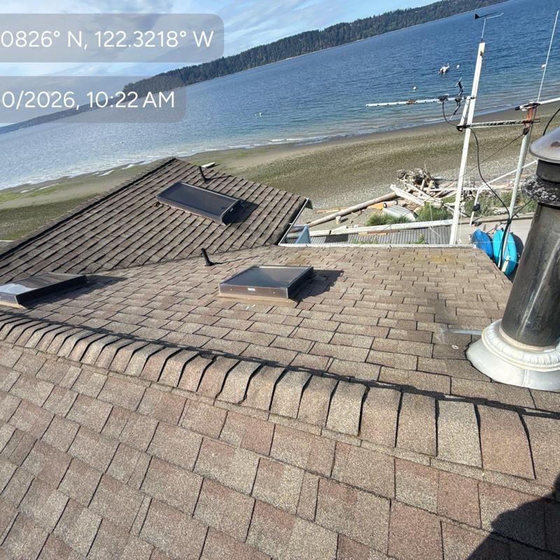 Asphalt shingle roof with skylights near shoreline