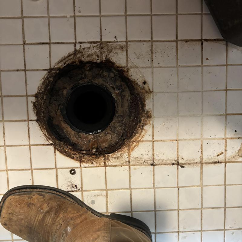 Toilet flange on tiled floor before wax seal installation Toilet flange on tiled floor before wax seal installation