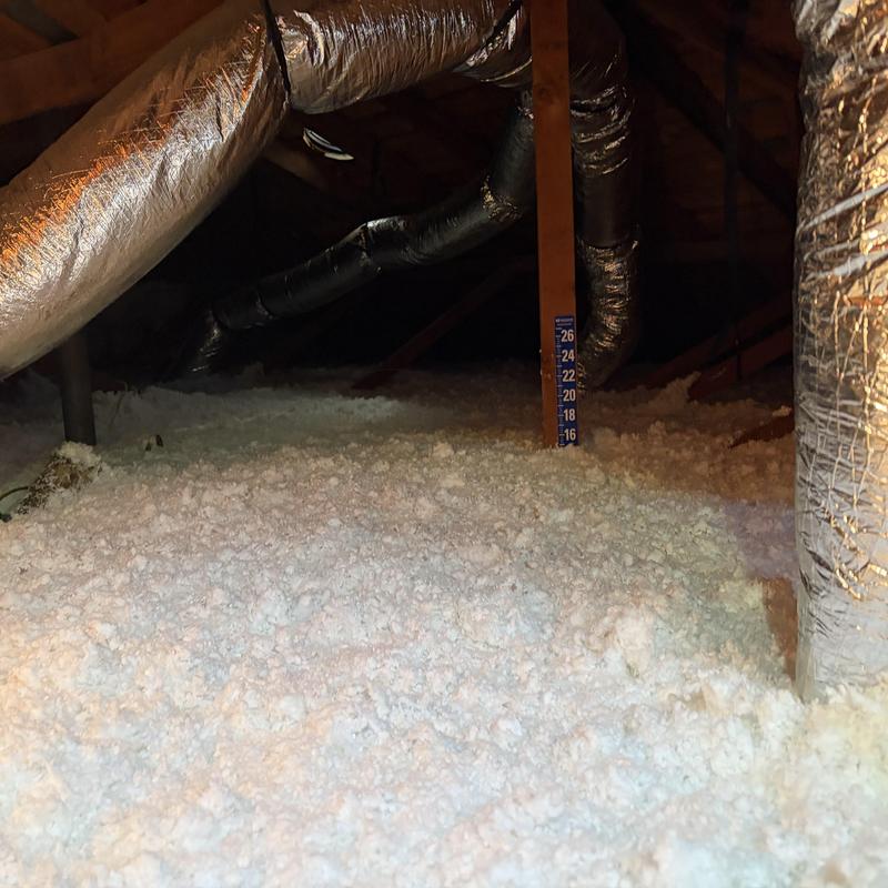 Attic loose-fill insulation with ductwork and depth gauge Attic loose-fill insulation with ductwork and depth gauge