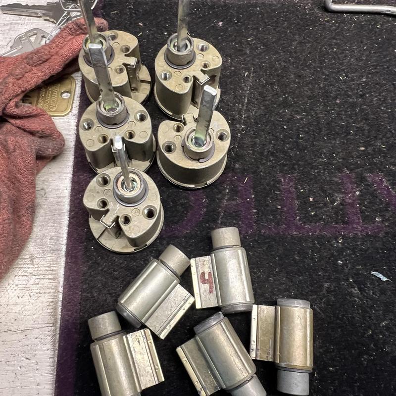 House door lock cylinders and cams arranged on mat House door lock cylinders and cams arranged on mat