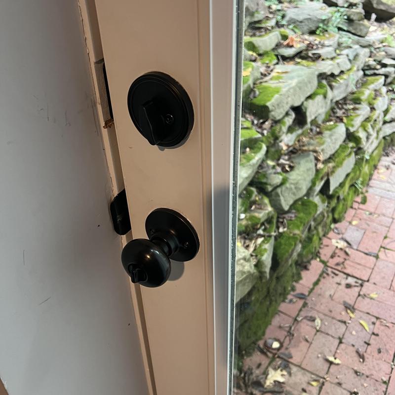Door deadbolt and knob lock set on white door Door deadbolt and knob lock set on white door