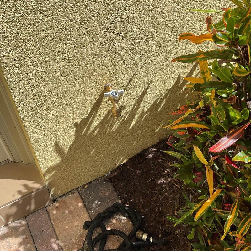 Quarter turn hose bib on exterior wall with garden hose Quarter turn hose bib on exterior wall with garden hose
