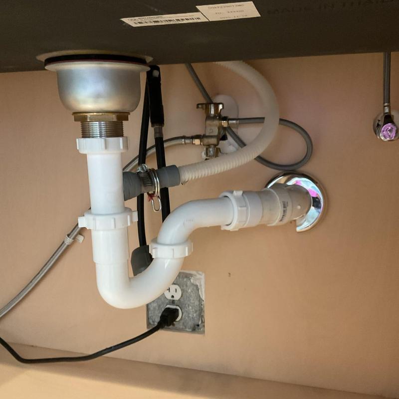 Basket strainer and drainage pipes under kitchen sink