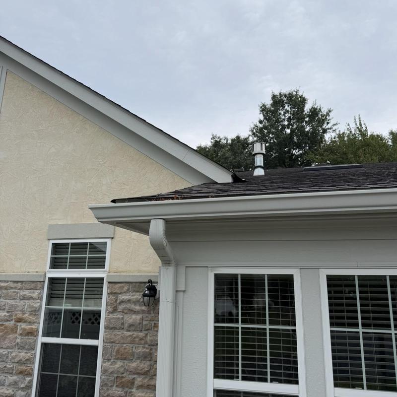 Asphalt shingle roof with repaired water leak on condo Asphalt shingle roof with repaired water leak on condo