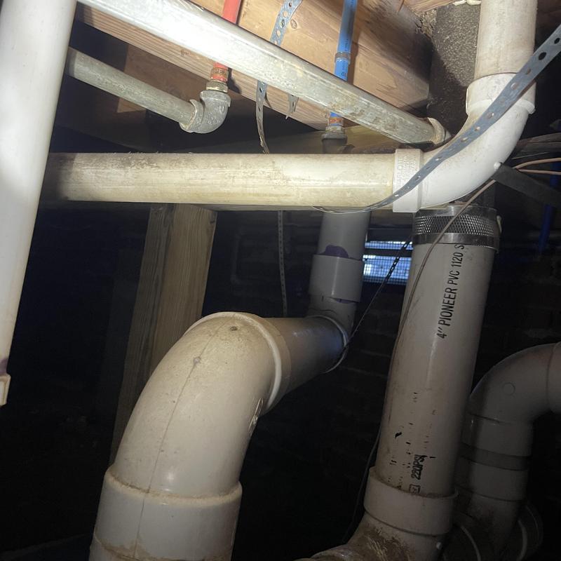 4-inch PVC drain pipe with fittings in crawl space 4-inch PVC drain pipe with fittings in crawl space