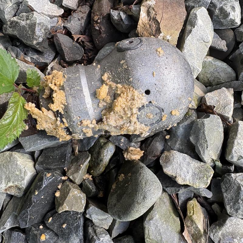 Fire hydrant with mineral buildup on rocks Fire hydrant with mineral buildup on rocks