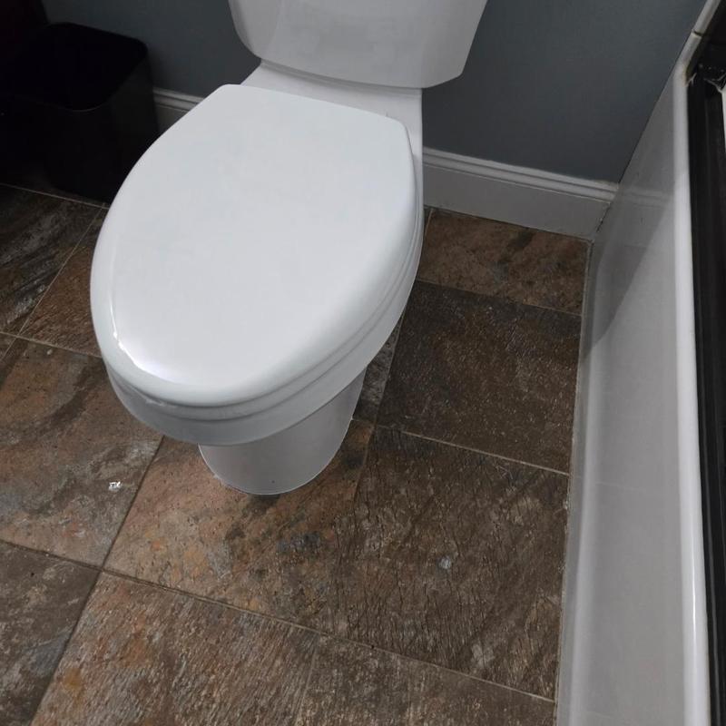 Toilet replacement in bathroom with tile flooring Toilet replacement in bathroom with tile flooring