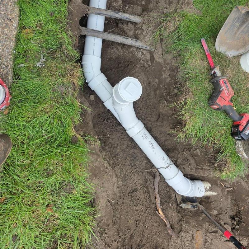 PVC cleanout installation with ground penetration repair PVC cleanout installation with ground penetration repair