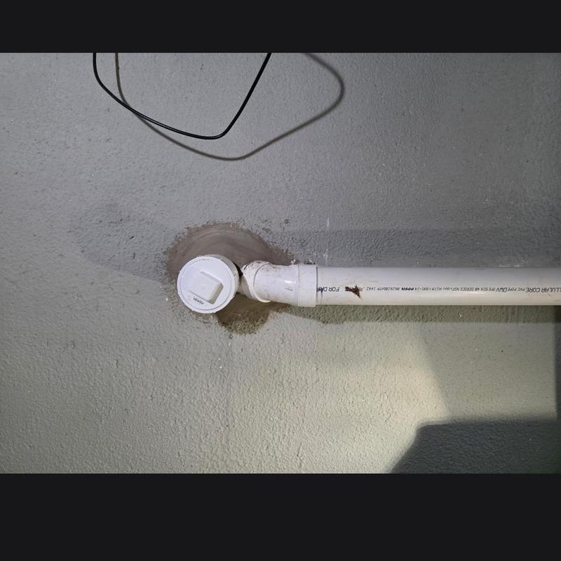 Cleanout pipe with new wall penetration seal Cleanout pipe with new wall penetration seal