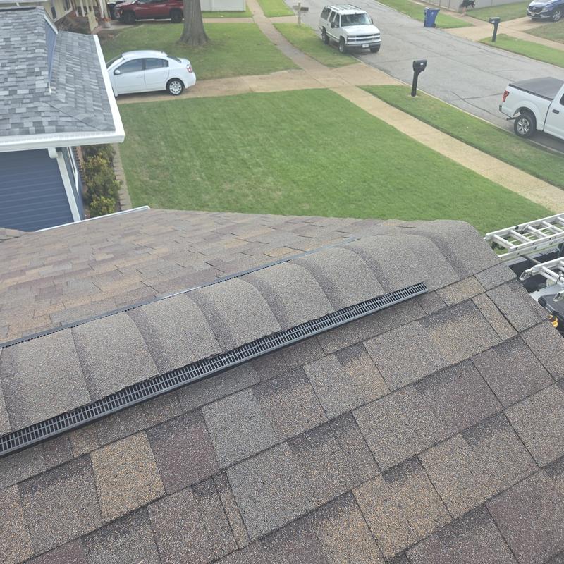 Ridge vent on new asphalt shingle roof installation