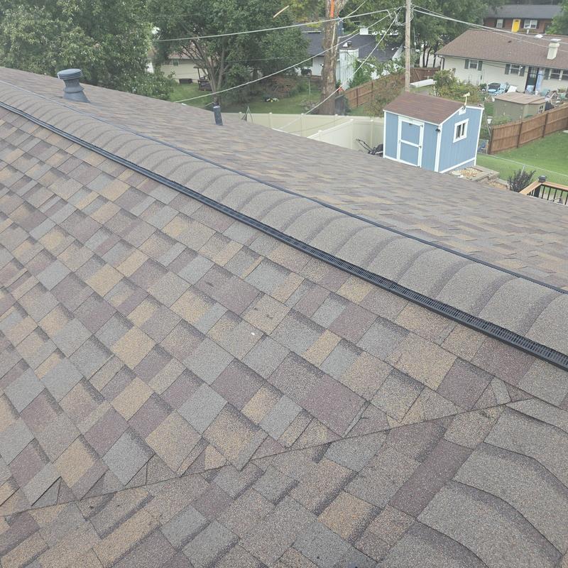 Asphalt shingle roof with ridge vent and drip edge installation