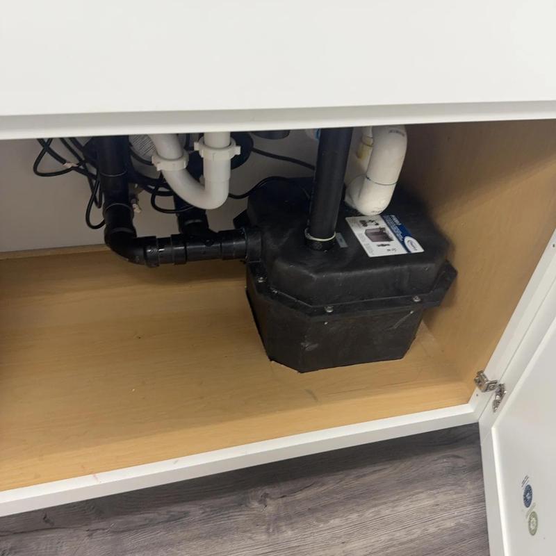 Under cabinet PROFLO sink pump with drain pipes Under cabinet PROFLO sink pump with drain pipes