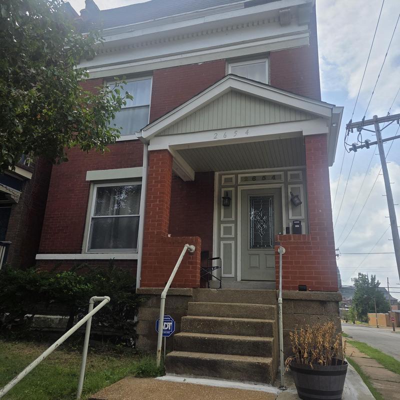 Front porch and steps of brick house exterior