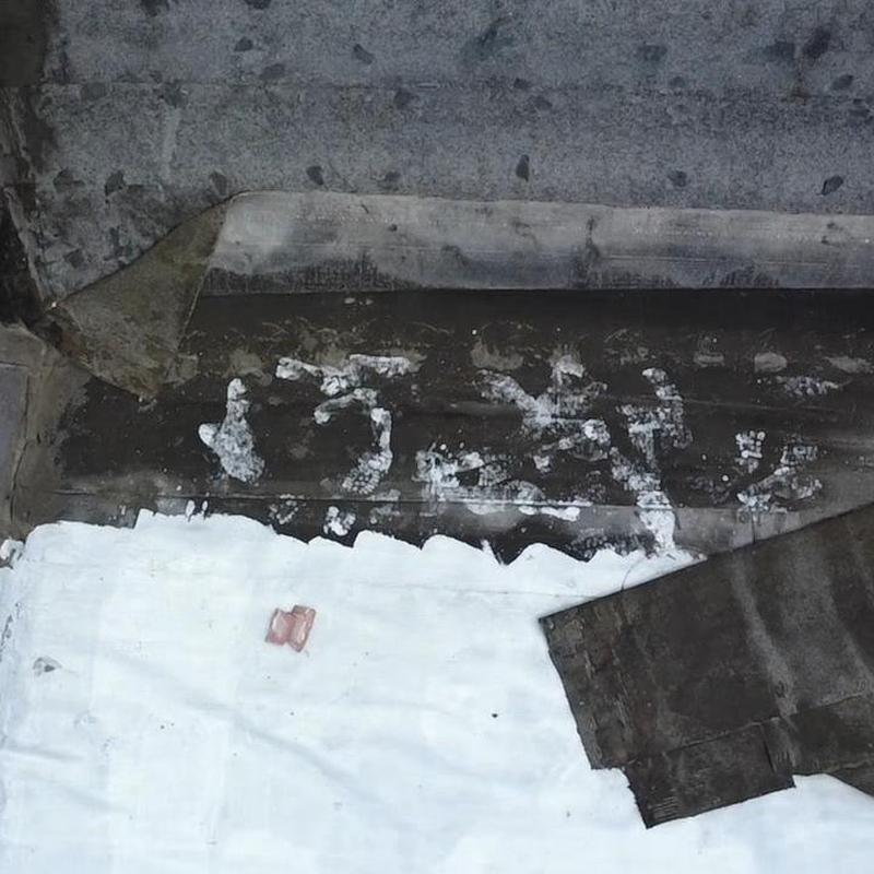 ModBit roofing membrane with damage and wear signs