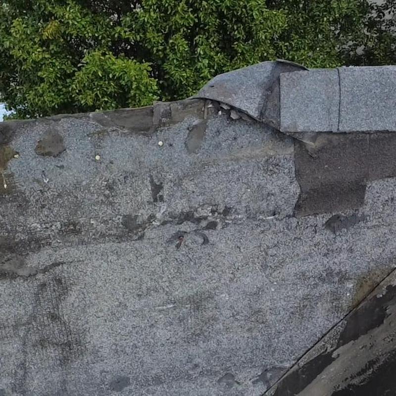 ModBit roofing surface showing damage and wear