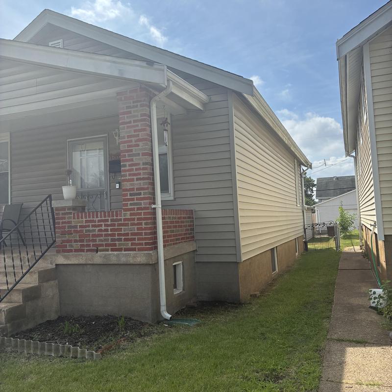 House siding and gutter downspout exterior view