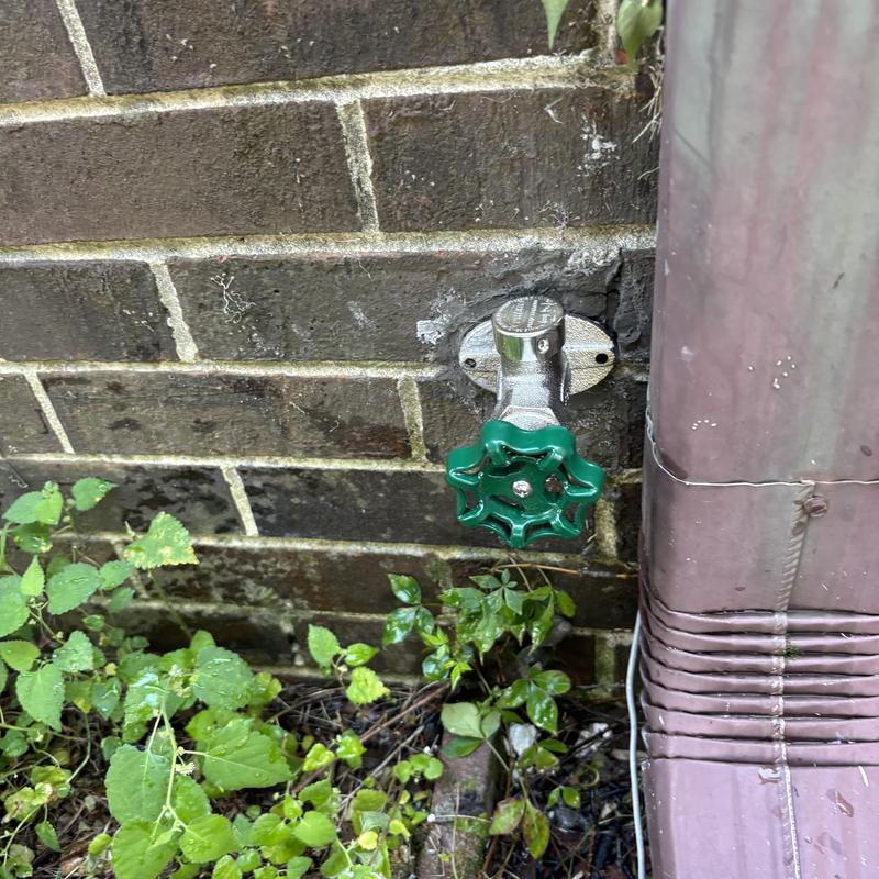 Frost-free hosebib valve on brick exterior wall Frost-free hosebib valve on brick exterior wall