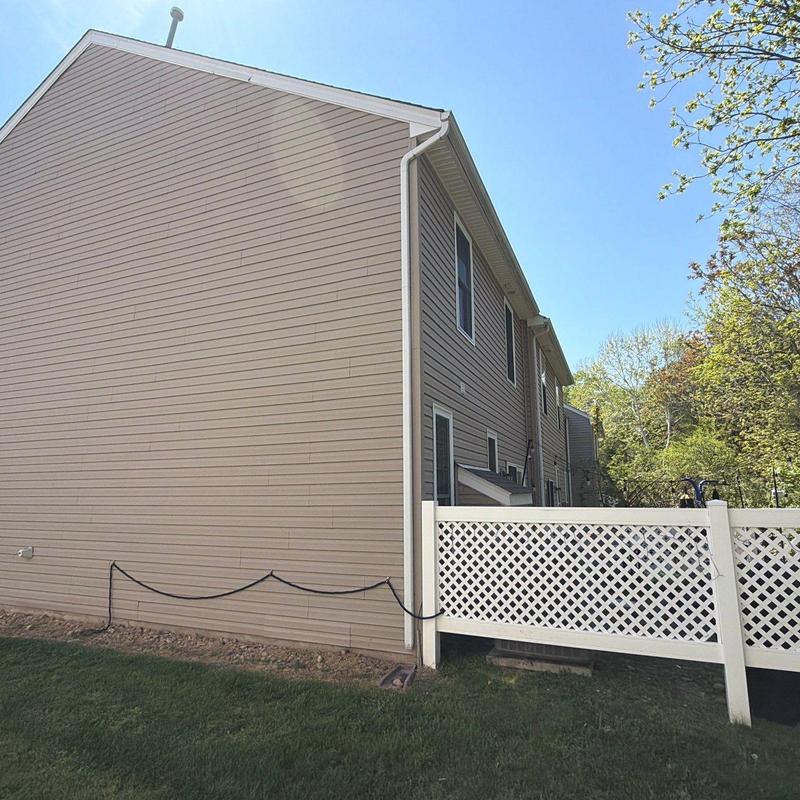 Vinyl siding and gutter system on townhouse exterior