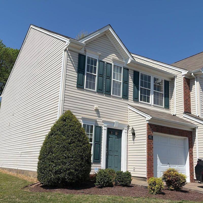 Vinyl siding and roofing system inspection on townhouse