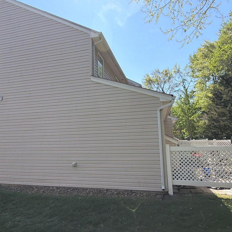 Vinyl siding and gutter installation on residential home