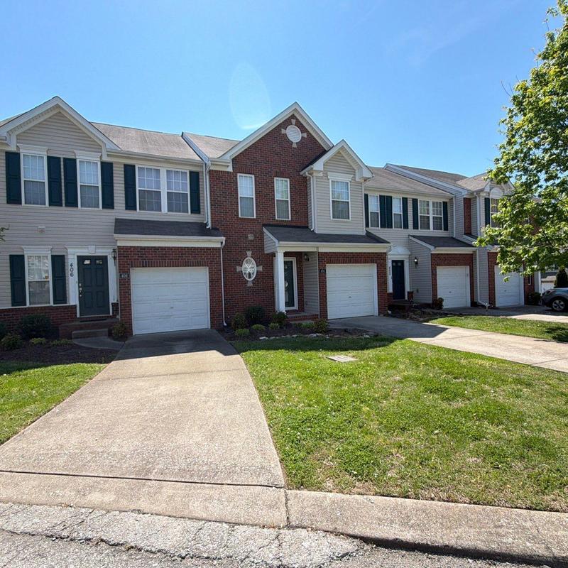 Residential asphalt shingle roofing and garage exterior