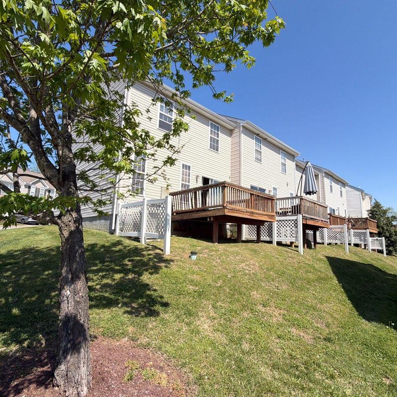 Residential roofing system and wooden decks on hillside
