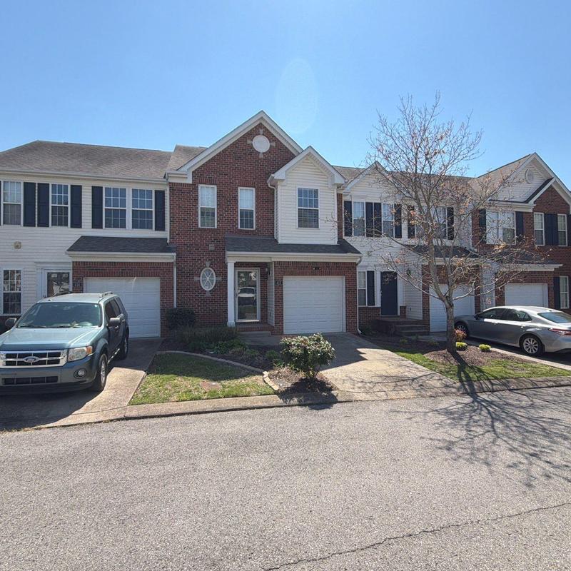 Asphalt shingle roofing system on townhouse units