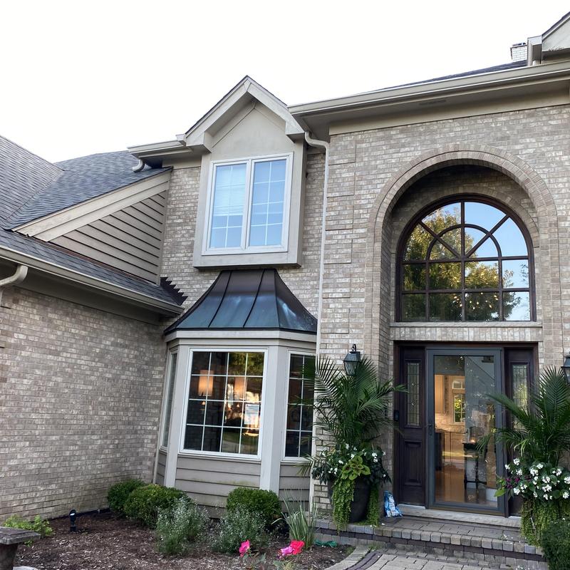 Atlas impact Class 4 roofing and gutters on brick home