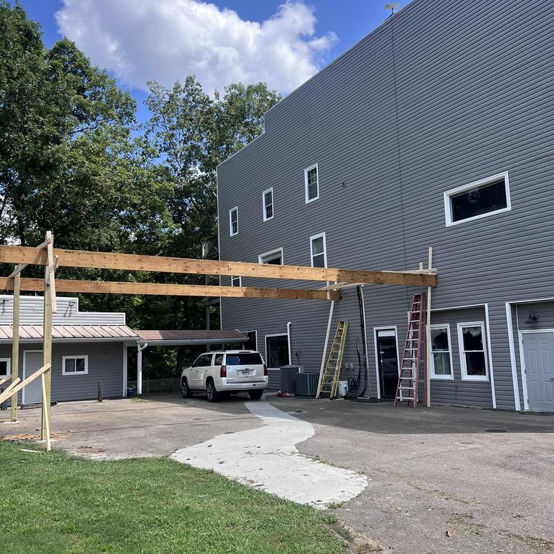 Vinyl siding replacement with wooden beam framework