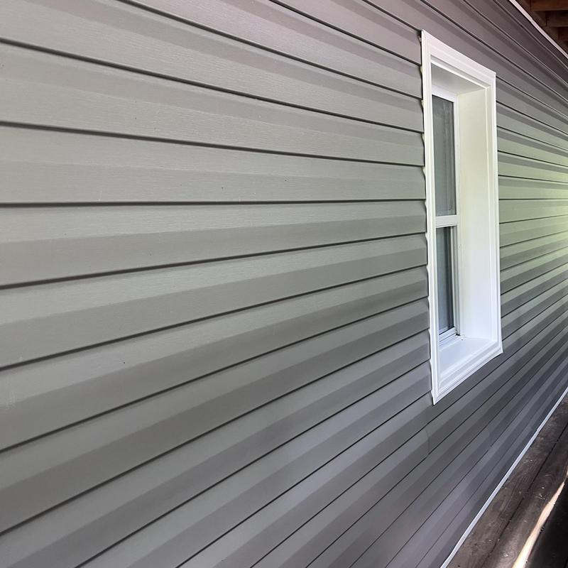 Elm Grove vinyl siding with white window trim