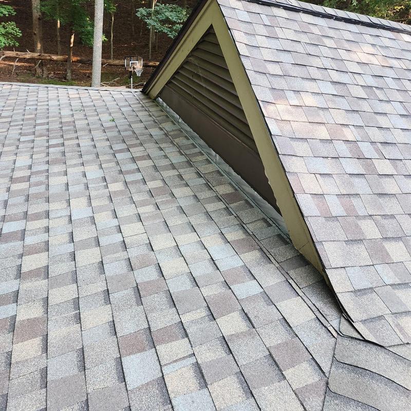Headwall flashing installation on asphalt shingle roof