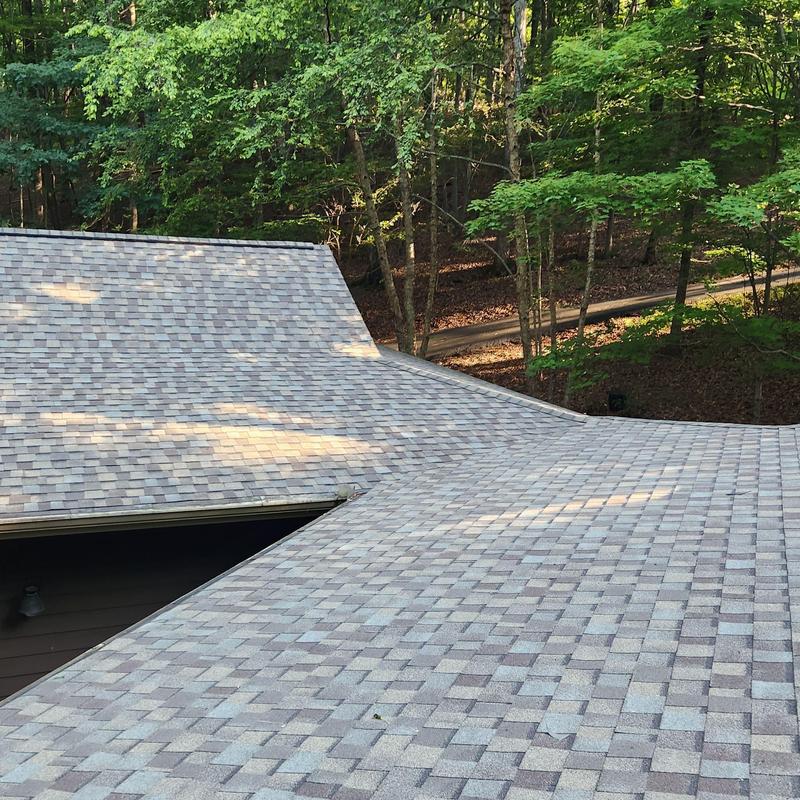 Roof shingles and headwall flashing installation on home roof