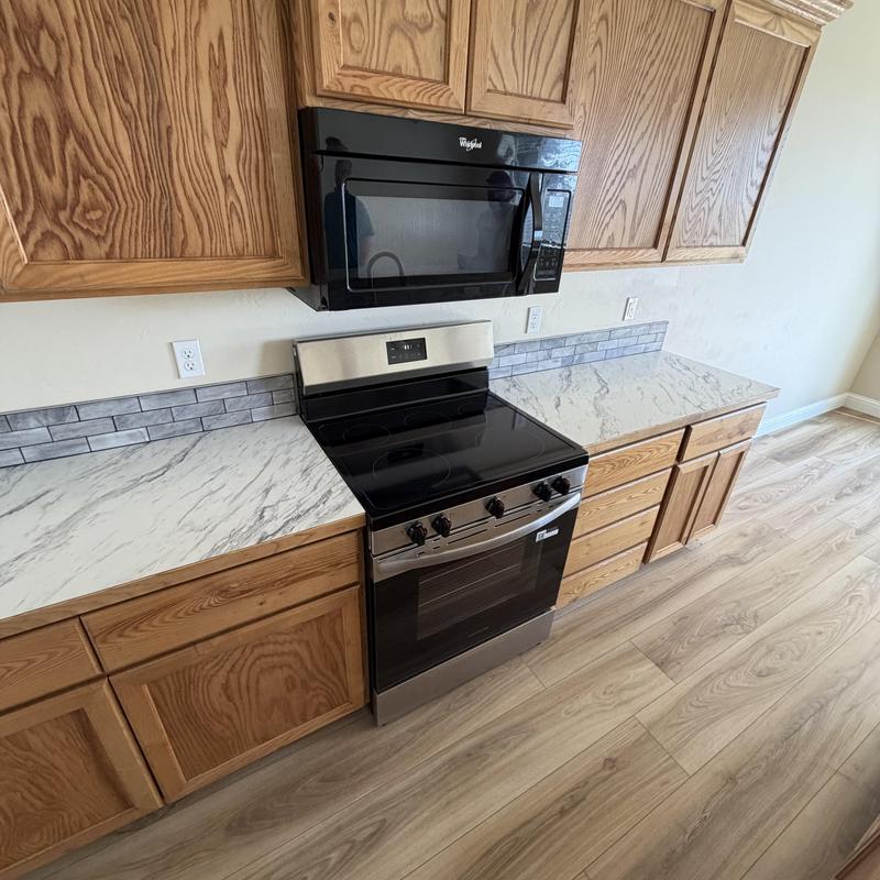 Gas range installation with cabinetry and countertops Gas range installation with cabinetry and countertops
